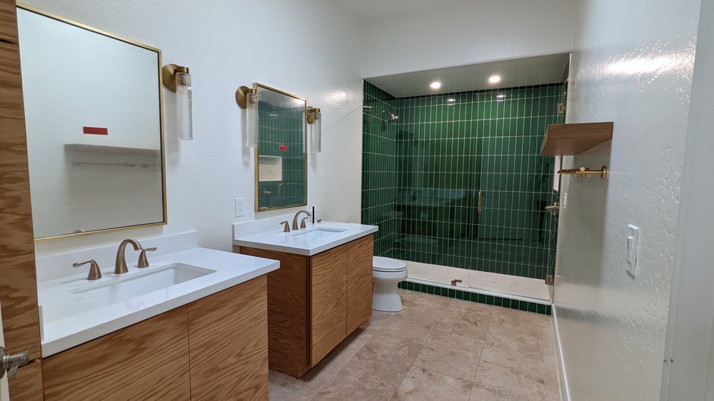 A bathroom with two sinks and a shower — Bathroom Remodeling by Urban Element, Inc. in the East Valley of Arizona