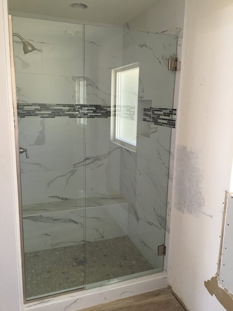 Custom hinged shower glass and porcelain tile shower — Bathroom Remodeling by Urban Element, Inc. in the East Valley of Arizona