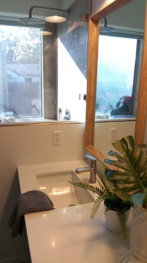 Floating quartz vanity with undermount sink — Bathroom Remodeling by Urban Element, Inc. in the East Valley of Arizona