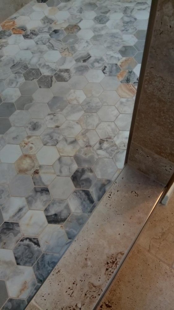 Marble hex shower floor with travertine curb — Bathroom Remodeling by Urban Element, Inc. in the East Valley of Arizona