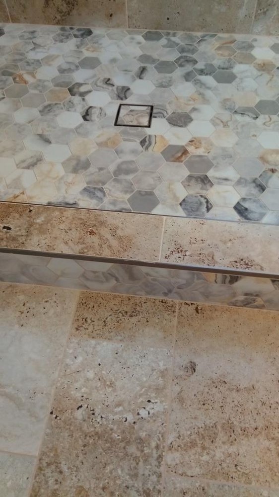 Marble hex shower step with travertine floor — Bathroom Remodeling by Urban Element, Inc. in the East Valley of Arizona