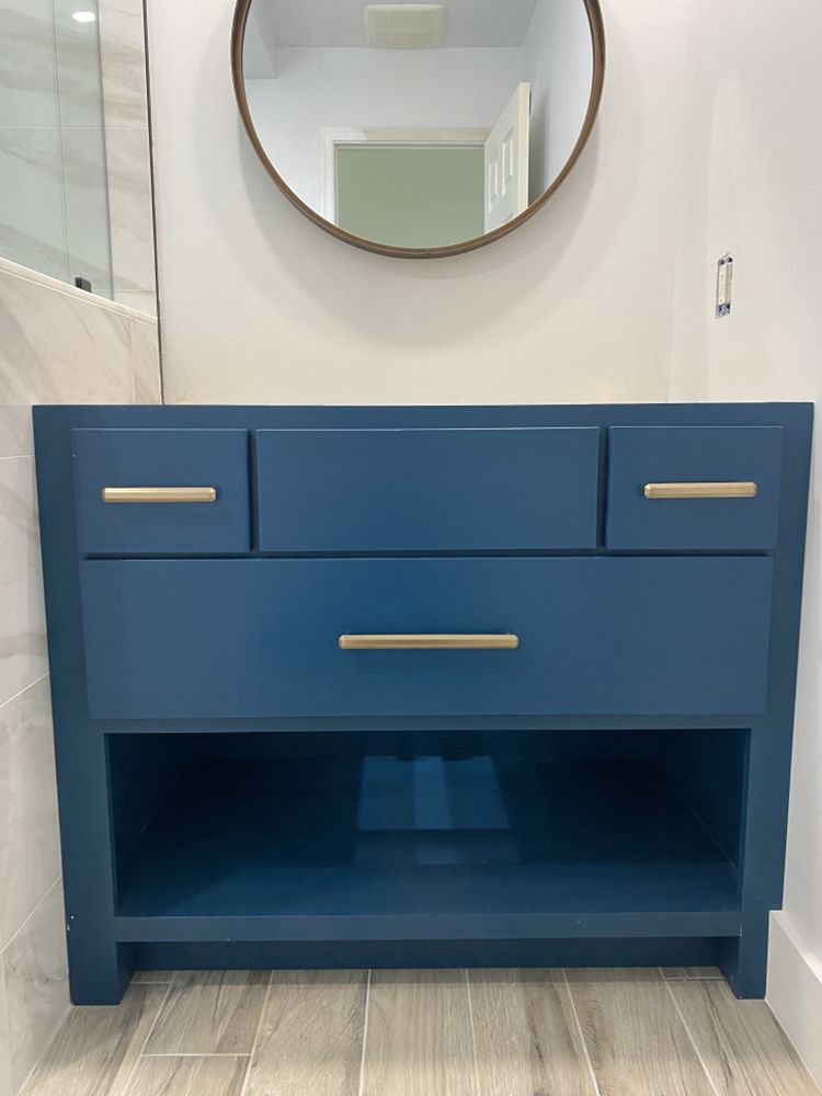 Modern blue vanity cabinet with antique bronze hardware — Bathroom Remodeling by Urban Element, Inc. in the East Valley of Arizona