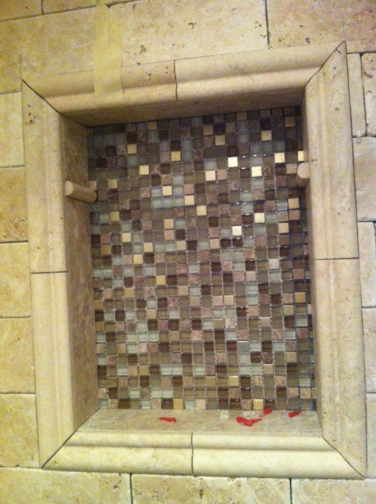 Travertine tile shampoo niche with mosaic tile inlay — Bathroom Remodeling by Urban Element, Inc. in the East Valley of Arizona
