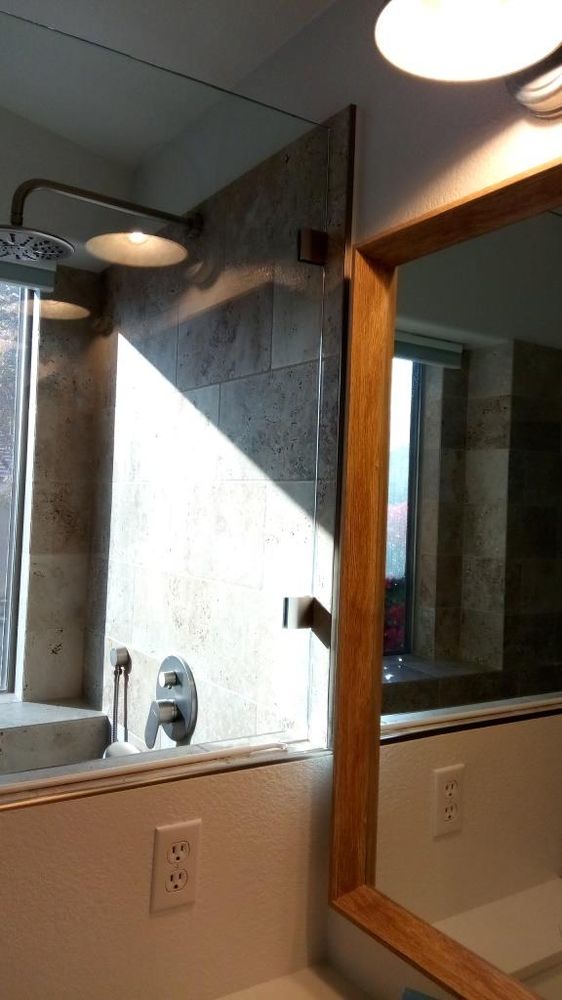 Travertine tile shower with custom glass enclosure — Bathroom Remodeling by Urban Element, Inc. in the East Valley of Arizona