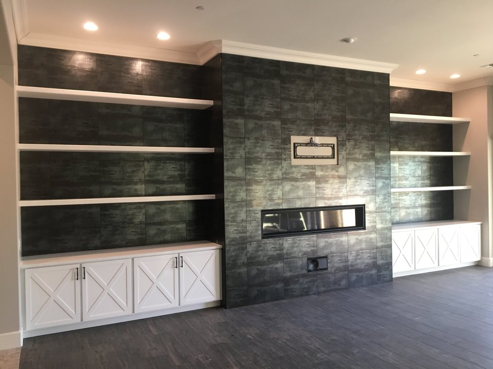 Tile fireplace wall with floating shelves and custom cabinets — Custom Designs by Urban Element, Inc. in the East Valley of Arizona