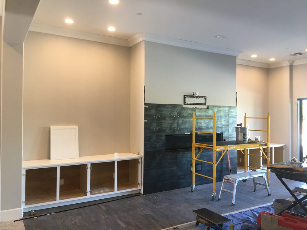 Tile fireplace wall with floating shelves and custom cabinets — Custom Designs by Urban Element, Inc. in the East Valley of Arizona