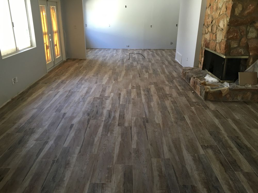 Wood look tile floor with natural stone fireplace — Custom Designs by Urban Element, Inc. in the East Valley of Arizona