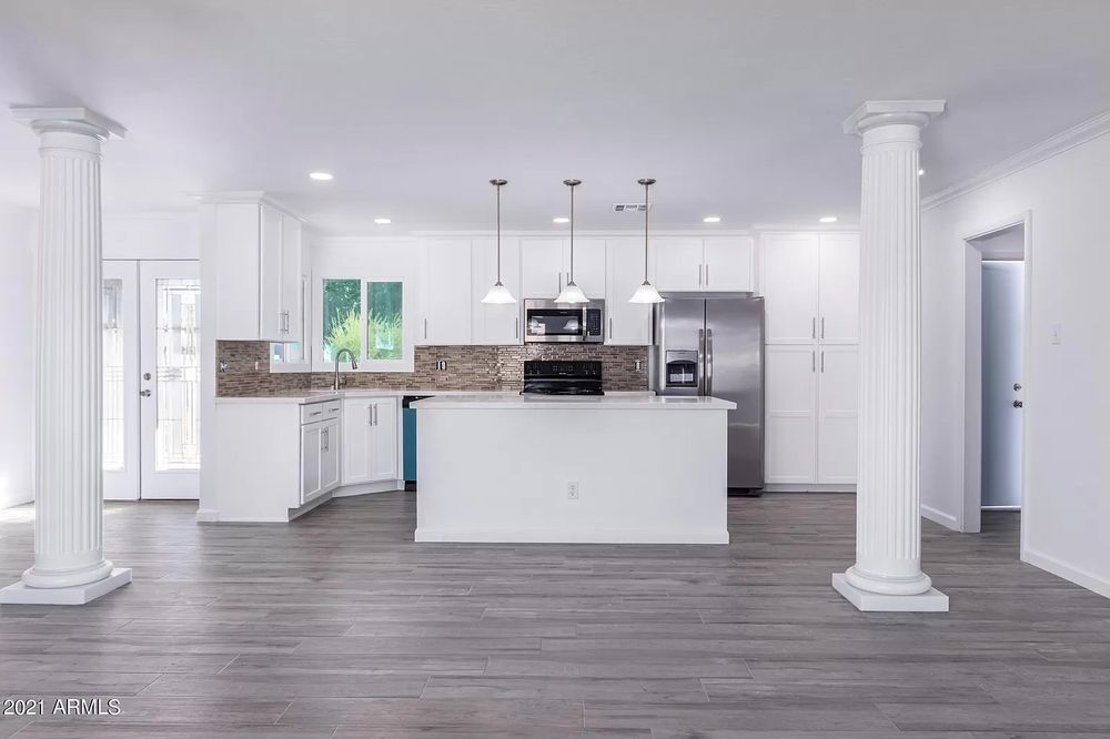 A kitchen with white cabinets and wood floors — Kitchen Remodeling by Urban Element, Inc. in the East Valley of Arizona