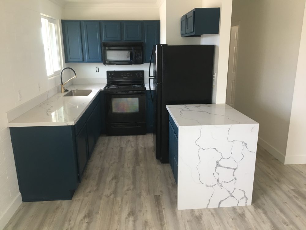 Blue cabinets with calacatta waterfall quartz island — Kitchen Remodeling by Urban Element, Inc. in the East Valley of Arizona