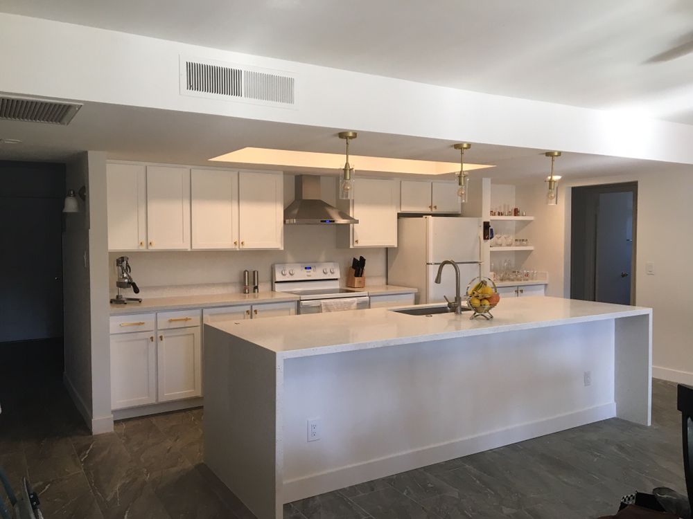 White quartz waterfall countertop with white shaker kitchen cabinets — Kitchen Remodeling by Urban Element, Inc. in the East Valley of Arizona