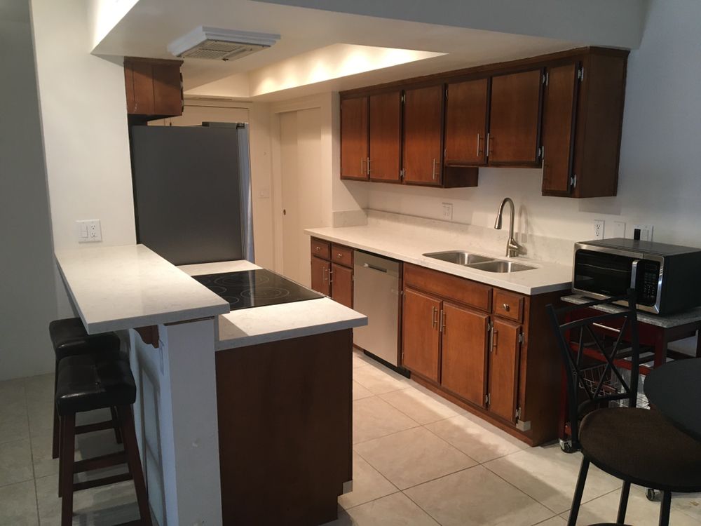 Wood cabinets with new white quartz countertops — Kitchen Remodeling by Urban Element, Inc. in the East Valley of Arizona